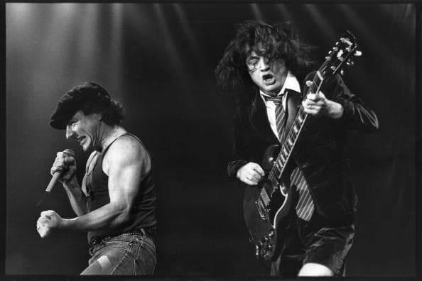UNSPECIFIED - APRIL 06: GROENOORDHALLEN Photo of AC/DC and AC DC and Angus YOUNG and Brian JOHNSON, Brian Johnson and Angus Young performing on stage (Photo by Rob Verhorst/Redferns)