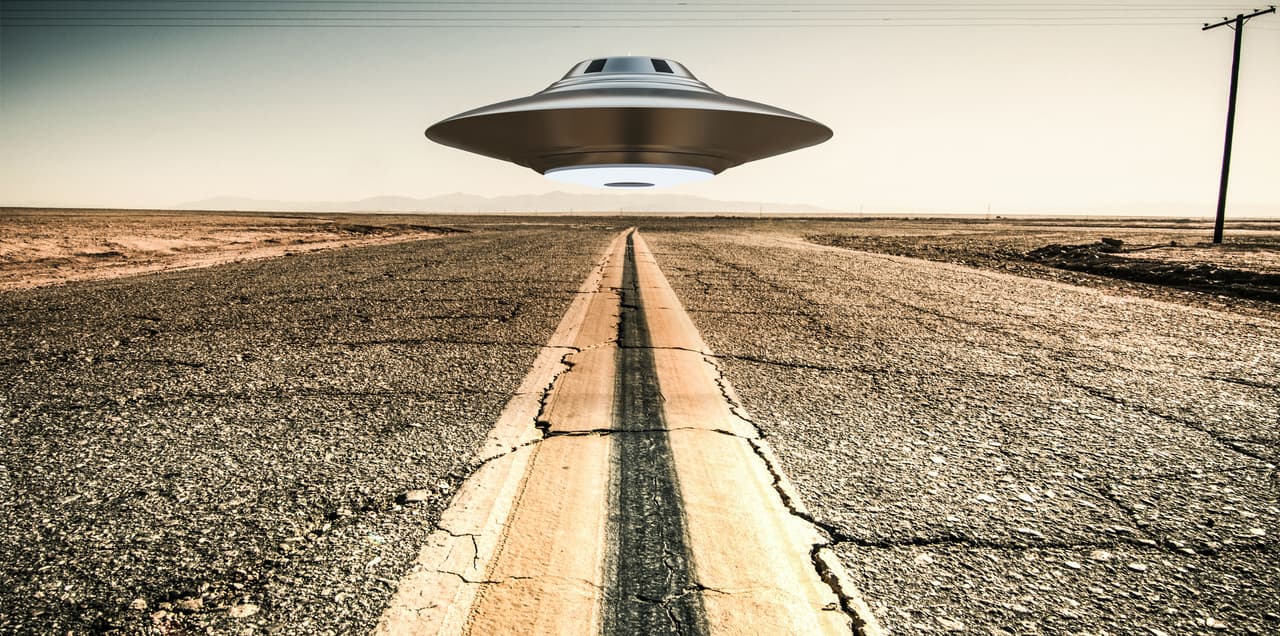 3d illustration of a unidentified flying object on a empty desert road.