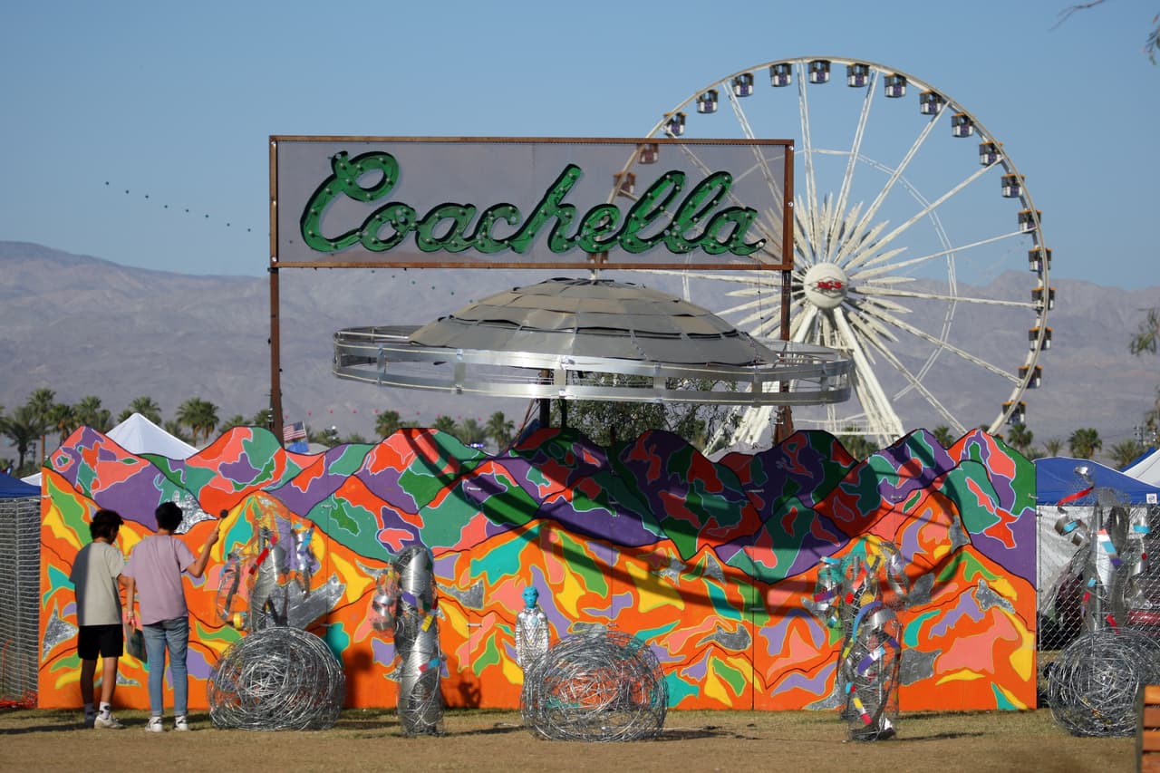 Festival-goers view the "Coachella Bound" art installation at the campgrounds at The Coachella Music and Arts Festival - Weekend 2, on Sunday, April 19, 2015, in Indio, Calif. (Photo by Zach Cordner/Invision/AP)