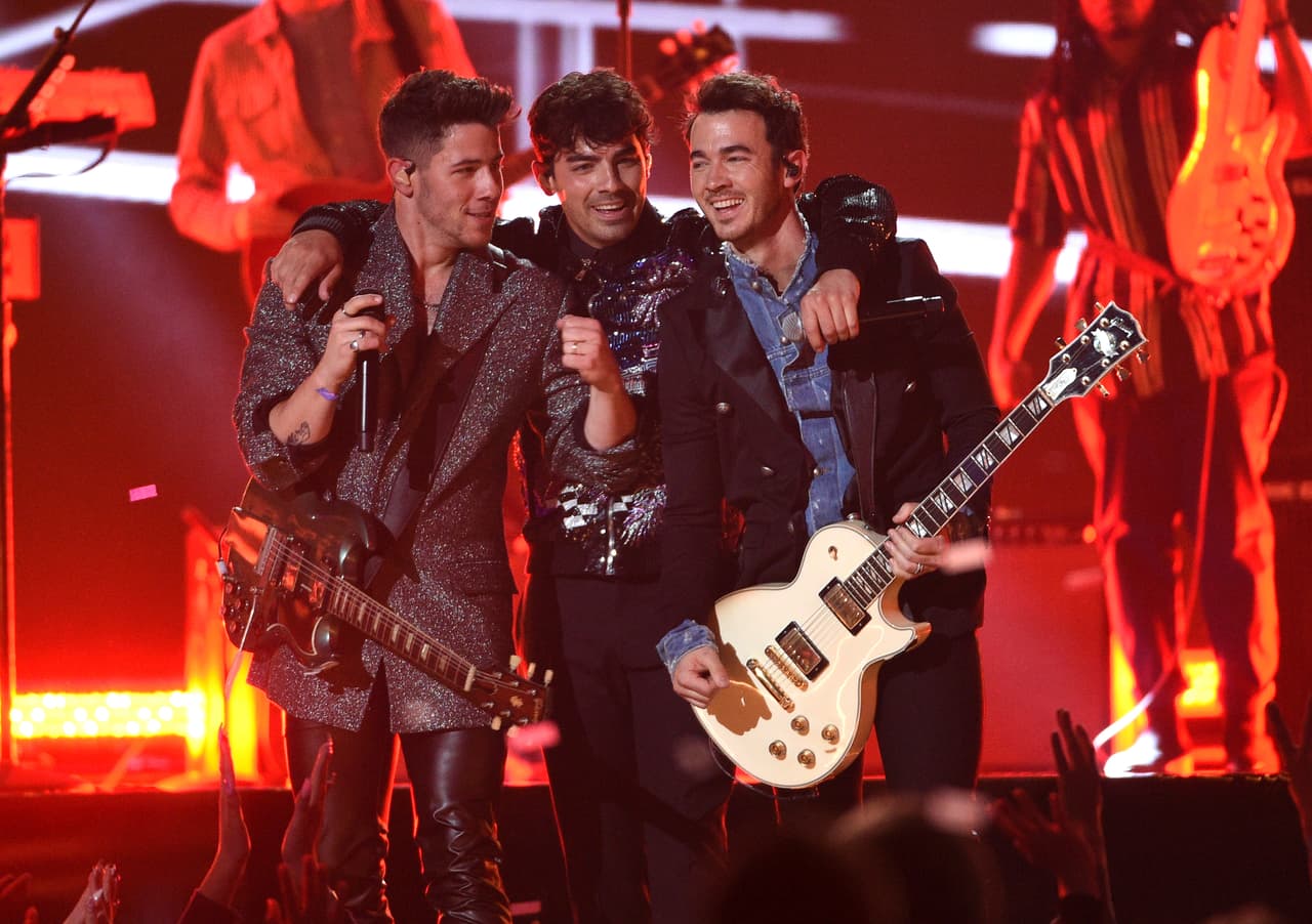 Nick Jonas, from left, Joe Jonas and Kevin Jonas, of the Jonas Brothers, perform a medley at the Billboard Music Awards on Wednesday, May 1, 2019, at the MGM Grand Garden Arena in Las Vegas. (Photo by Chris Pizzello/Invision/AP)