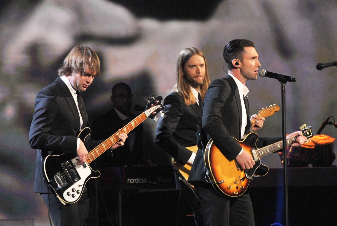 LOS ANGELES, CA - JANUARY 27: (L-R) Musicians Mickey Madden, Adam Levine and James Valentine of Maroon 5 perform onstage at "The Night That Changed America: A GRAMMY Salute To The Beatles" at the Los Angeles Convention Center on January 27, 2014 in Los Angeles, California. (Photo by Lester Cohen/WireImage)