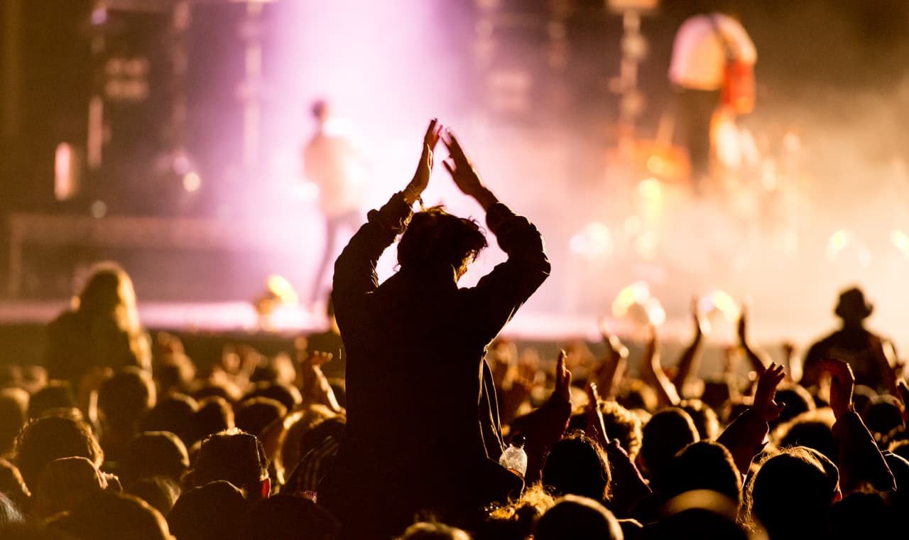 MATLOCK, UNITED KINGDOM - AUGUST 03: The crowd watch as on Frank Turner performs on the main stage headlining at the end of day 3 at Y Not Festival at Pikehall on August 3, 2014 in Matlock, United Kingdom. (Photo by Ollie Millington/Redferns via Getty Images)