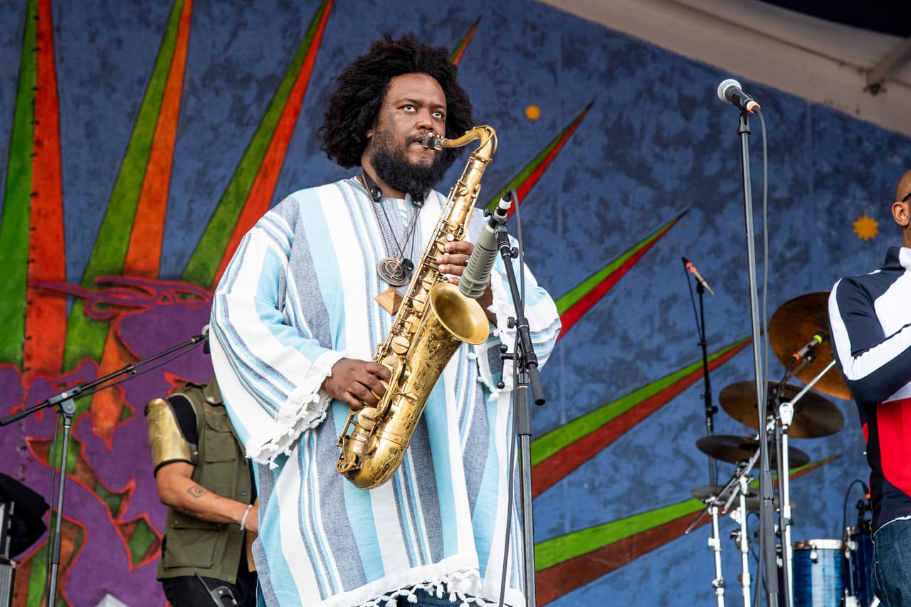 Kamasi Washington performs at the New Orleans Jazz and Heritage Festival on Friday, May 3, 2019, in New Orleans. (Photo by Amy Harris/Invision/AP)