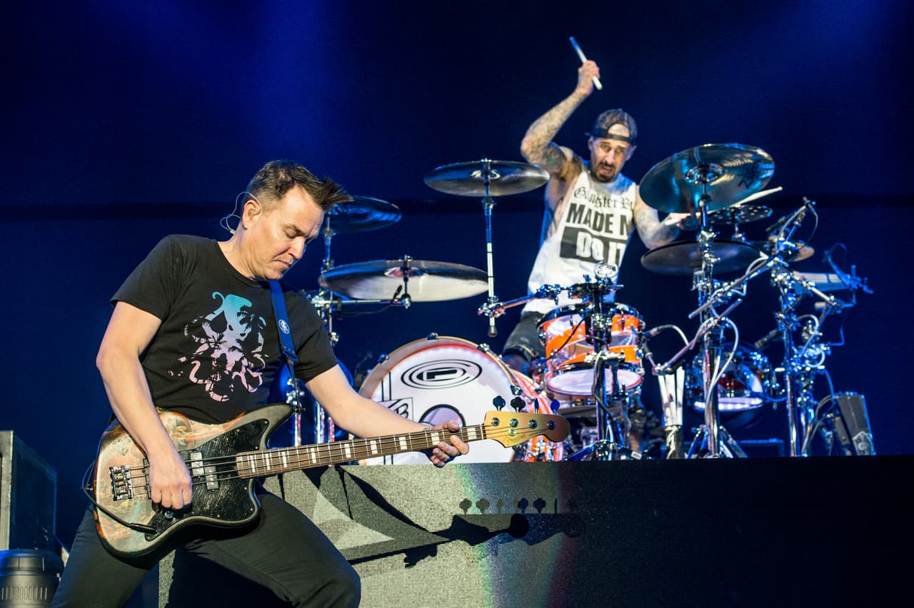 Mark Hoppus, left, and Travis Barker of blink-182 perform at the 2016 KROQ Almost Acoustic Christmas at The Forum on Saturday, Dec. 10, 2016, in Inglewood, Calif. (Photo by Amy Harris/Invision/AP)