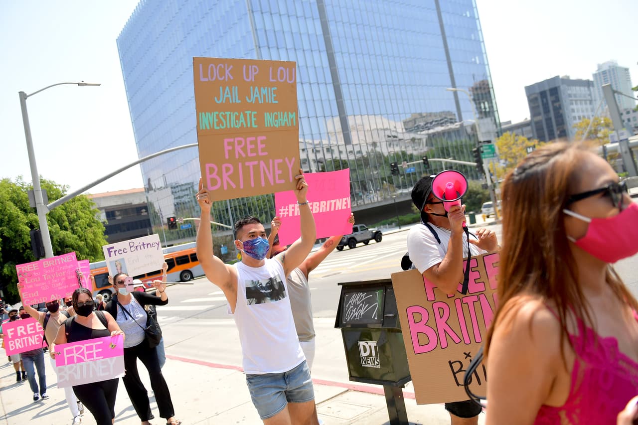 LOS ANGELES, CALIFORNIA - AUGUST 19: Supporters of Britney Spears gather outside a courthouse in downtown for a #FreeBritney protest as a hearing regarding Spears' conservatorship is in session on August 19, 2020 in Los Angeles, California. Spears was placed in a conservatorship managed by her father, James Spears, and an attorney following her involuntary hospitalization for mental care in 2008. (Photo by Matt Winkelmeyer/Getty Images)