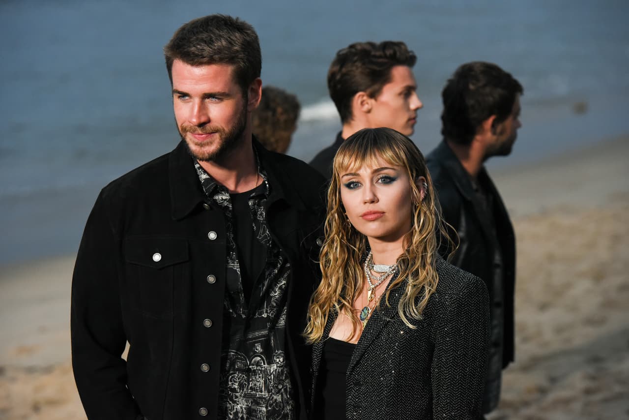 MALIBU, CALIFORNIA - JUNE 06: Liam Hemsworth and Miley Cyrus at Saint Laurent mens spring summer 20 show on June 06, 2019 in Malibu, California. (Photo by Presley Ann/WireImage,)