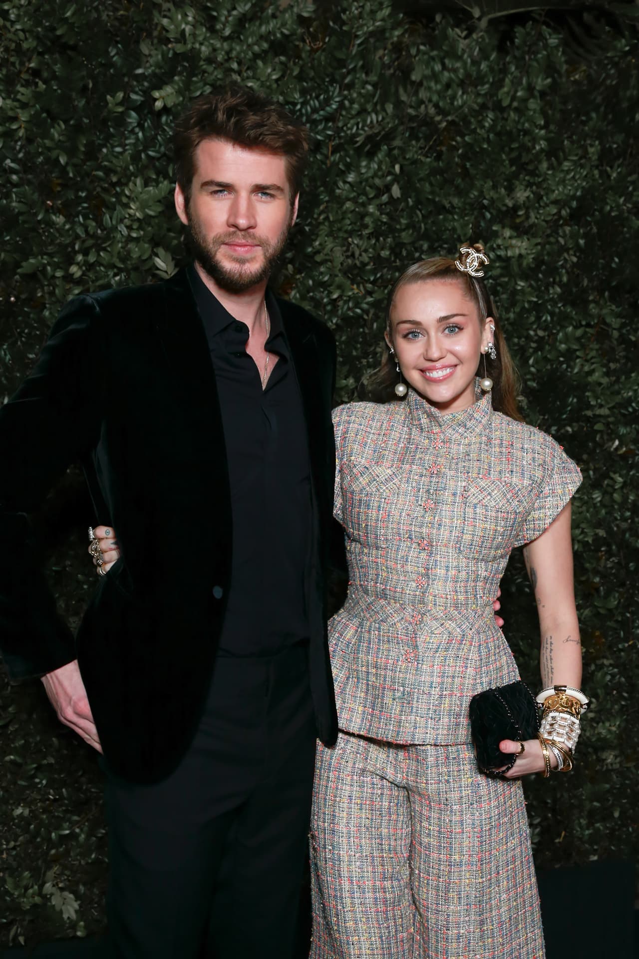 BEVERLY HILLS, CALIFORNIA - FEBRUARY 23: Miley Cyrus (R) and Liam Hemsworth attend Chanel And Charles Finch Pre-Oscar Awards Dinner at Polo Lounge at The Beverly Hills Hotel on February 23, 2019 in Beverly Hills, California. (Photo by Rochelle Brodin/Patrick McMullan via Getty Images)