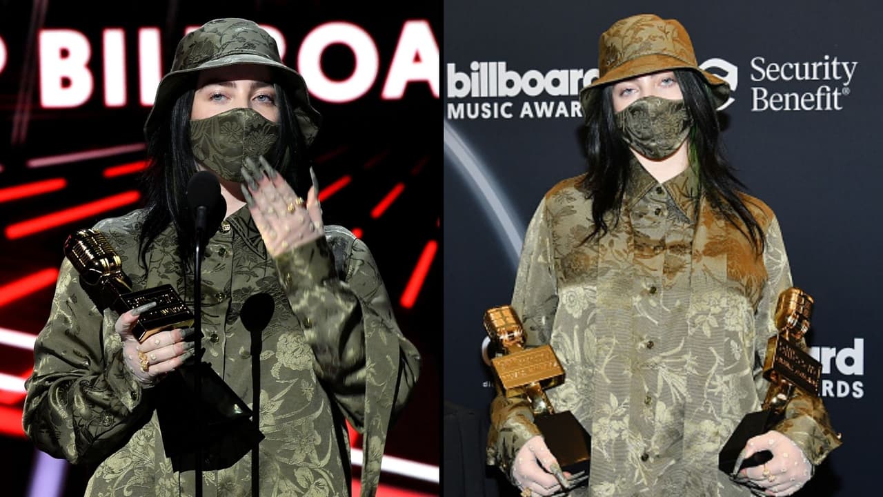 Billie Eilish se presentó en los Premios Billboard 2020 con un look estilo militar, con cubrebocas y gorra verde, como si fuera camuflaje. La blusa y el pantalón, holgados como acostumbra, también fueron de color verde olivo.