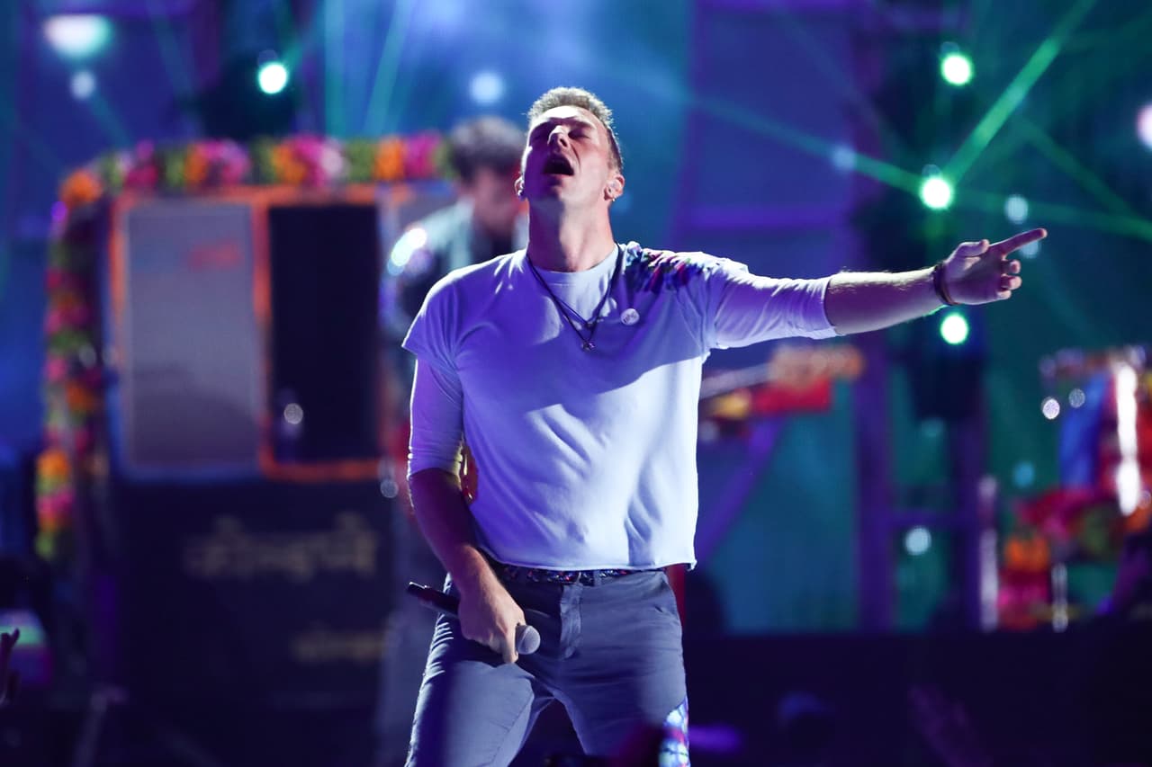 Chris Martin of Coldplay performs at the 2017 iHeartRadio Music Festival Day 1 held at T-Mobile Arena on Friday, Sept. 22, 2017, in Las Vegas. (Photo by John Salangsang/Invision/AP)
