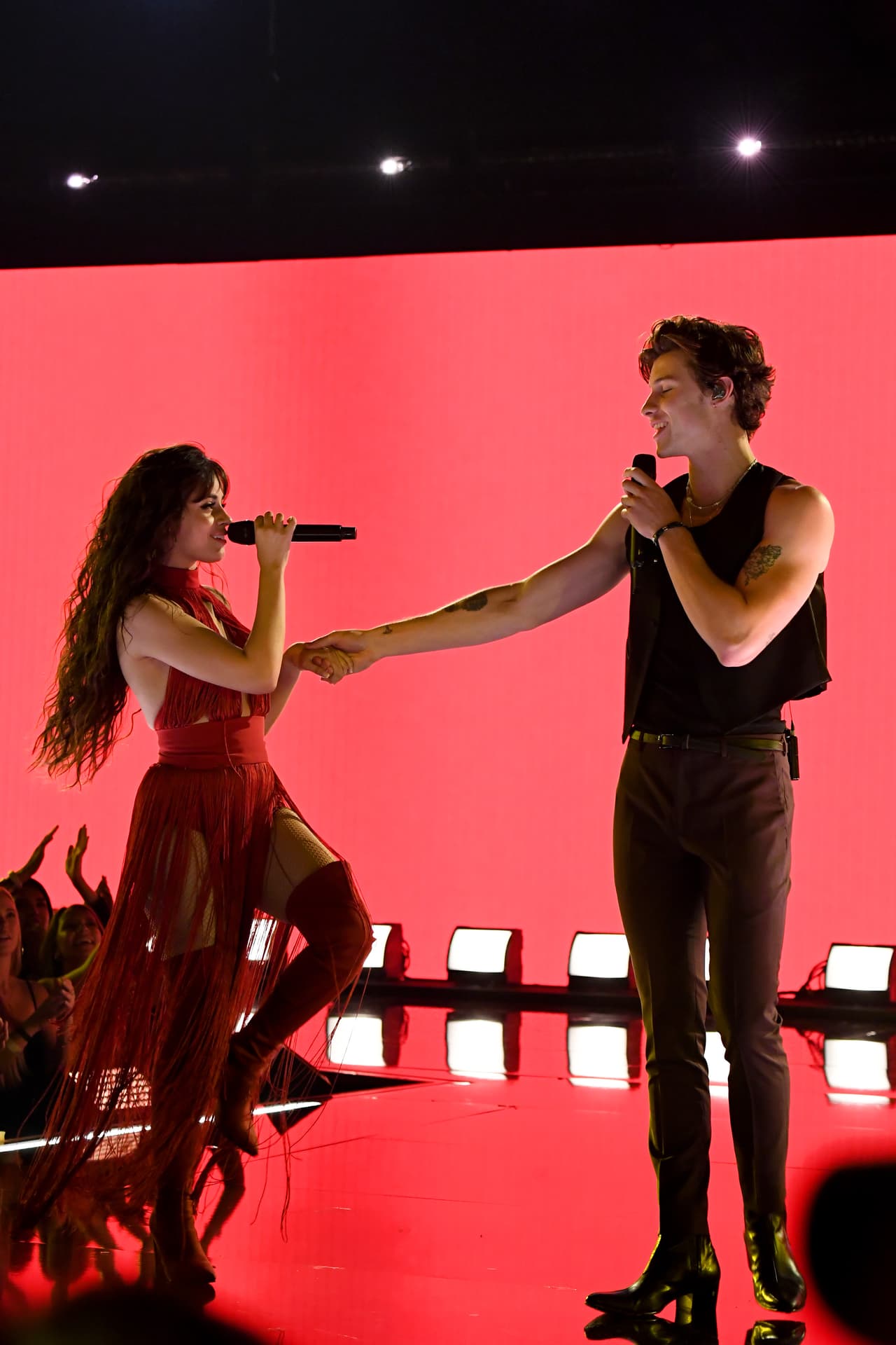 LOS ANGELES, CALIFORNIA - NOVEMBER 24: (L-R) Camila Cabello and Shawn Mendes perform onstage during the 2019 American Music Awards at Microsoft Theater on November 24, 2019 in Los Angeles, California. (Photo by Jeff Kravitz/AMA2019/FilmMagic for dcp)
