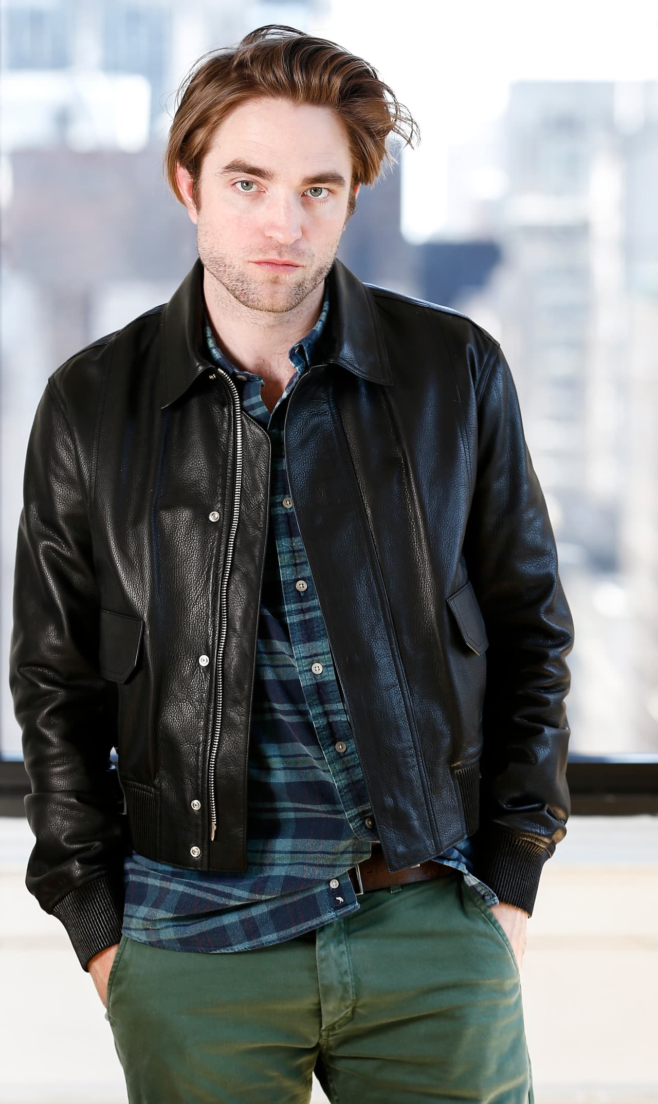 This April 4, 2019 photo shows actor Robert Pattinson posing for a portrait to promote his film, "High Life" in New York. (Photo by Brian Ach/Invision/AP)