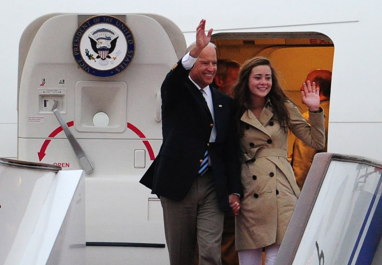 BEIJING, CHINA - AUGUST 17: U.S. Vice President Joe Biden (L) and his granddaughter Naomi Biden arrive for a visit at the Beijing Capital International Airport on August 17, 2011 in Beijing, China. Vice President Joe Biden, a veteran foreign policy hand during his 36-year Senate career, arrived for a five-day visit in China under a cloud of criticism over the U.S. debt, as he seeks to build a rapport with Xi Jinping, the man expected to be the rising Asian power's next leader. He will later visit emerging U.S. partner Mongolia and longstanding ally Japan. (Photo by Mark Ralston-Pool/Getty Images)