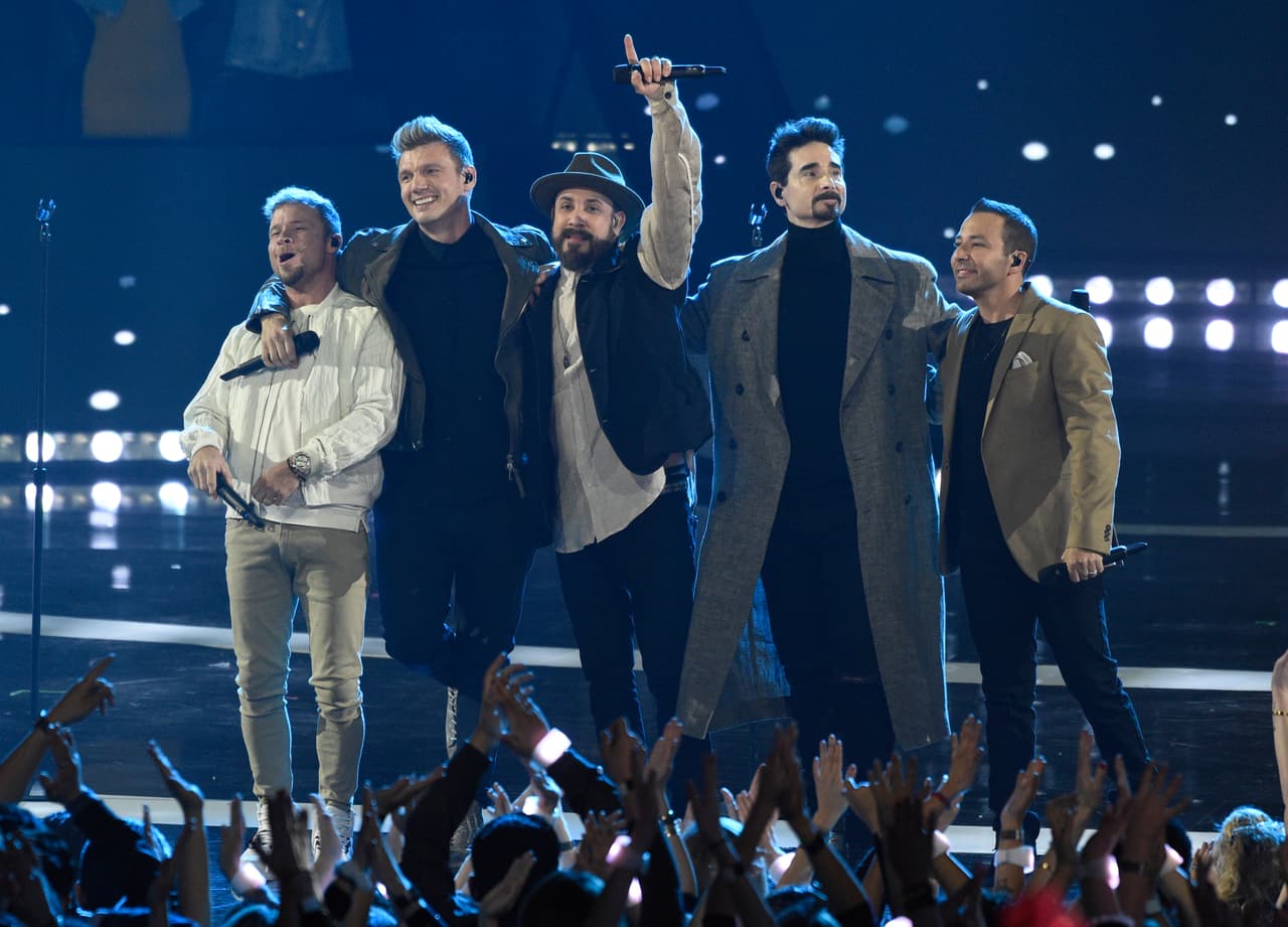 Brian Littrell, from left, Nick Carter, AJ McLean, Kevin Richardson and Howie Dorough, of Backstreet Boys, greet the audience after performing at the iHeartRadio Music Awards on Thursday, March 14, 2019, at the Microsoft Theater in Los Angeles. (Photo by Chris Pizzello/Invision/AP)