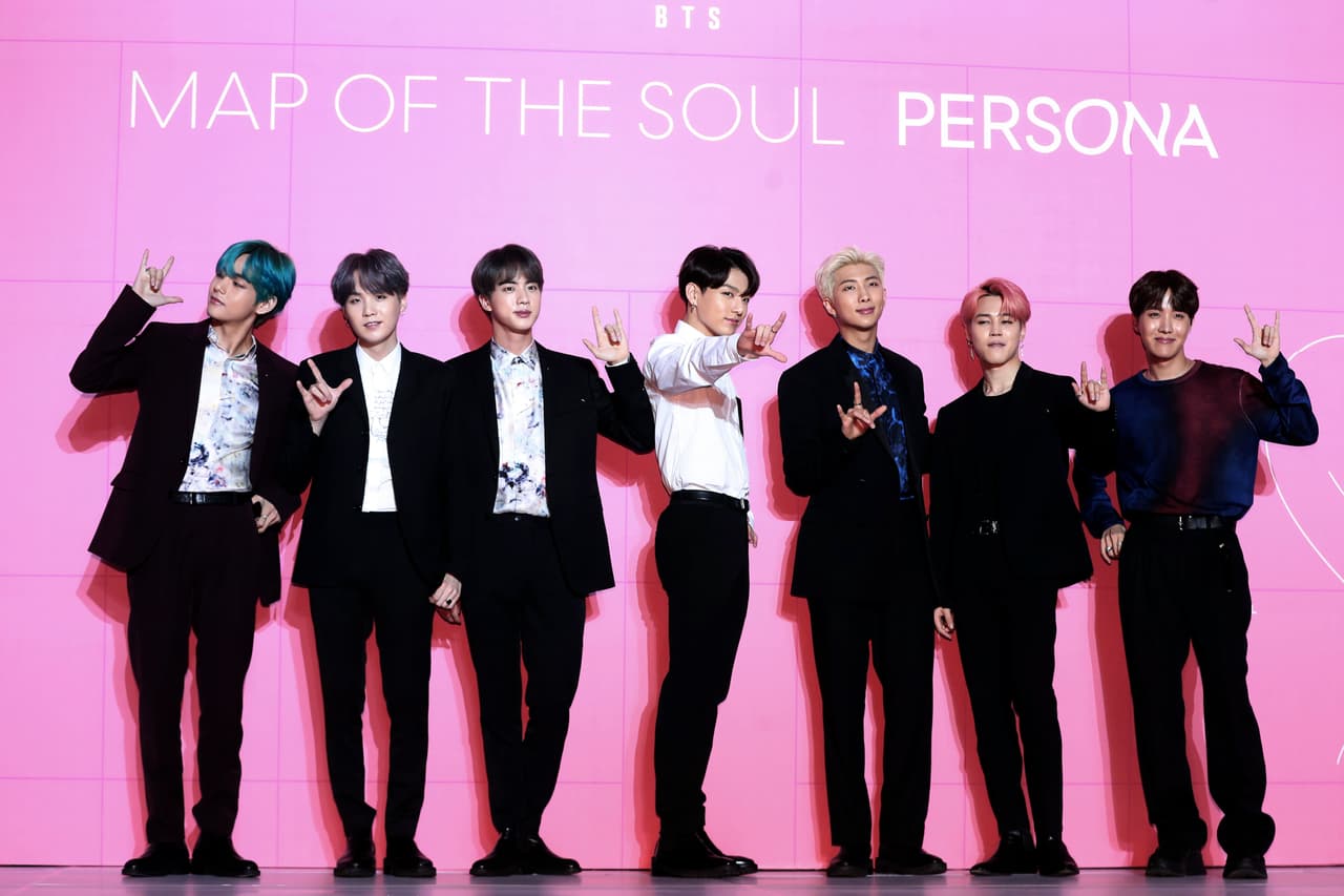 Members of South Korean K-Pop group BTS pose for photos during a press conference to introduce their new album "Map of the Soul: Persona" in Seoul, South Korea, Wednesday, April 17, 2019. (Jo Soo-jung/Newsis via AP)