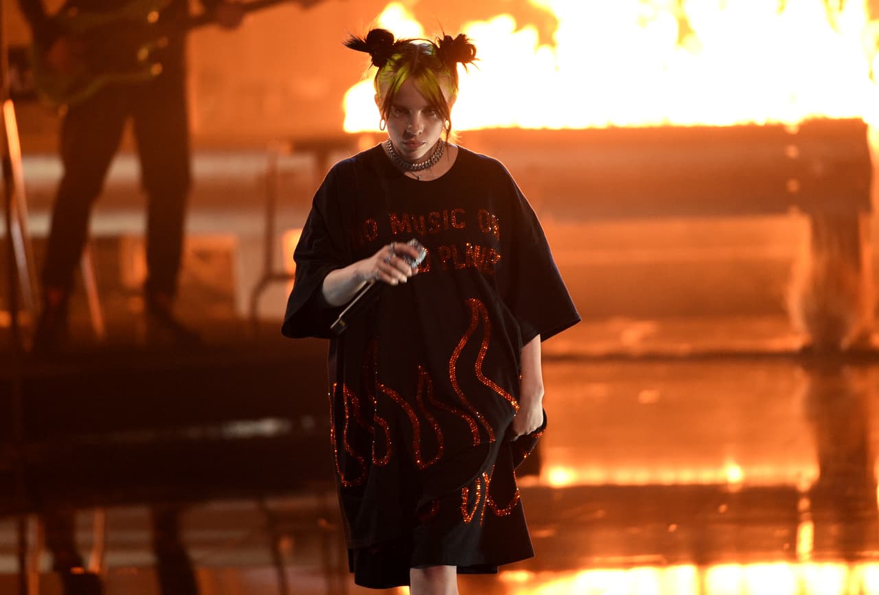 Billie Eilish performs "all the good girls go to hell" at the American Music Awards on Sunday, Nov. 24, 2019, at the Microsoft Theater in Los Angeles. (Photo by Chris Pizzello/Invision/AP)