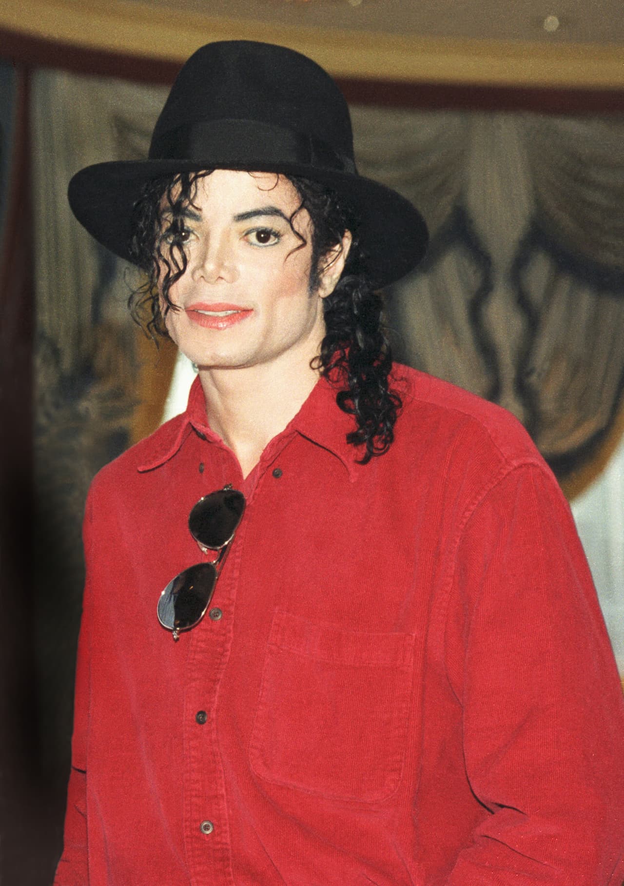 Michael Jackson poses at a press conference before a date on his HIStory world tour in 1996. (Photo by Phil Dent/Redferns)