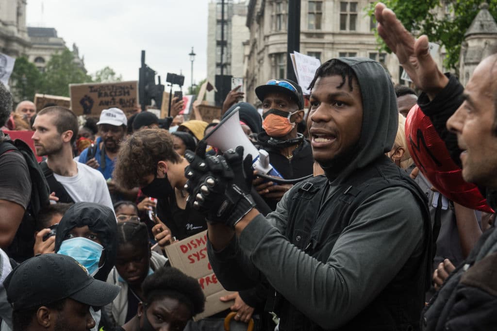 LONDON, ENGLAND - JUNE 3: Actor John Boyega speaks as protestors join a Black Lives Matter rally at Hyde Park before marching into central London and finishing at parliament square. Actor John Boyega addresses the crowd outside Parliament on June 3, 2020 in LONDON, United Kingdom. Protest continue around the world after George Floyd was killed while he was being detained by police in Minneapolis, Minnesota. (Photo by Guy Smallman/Getty images)