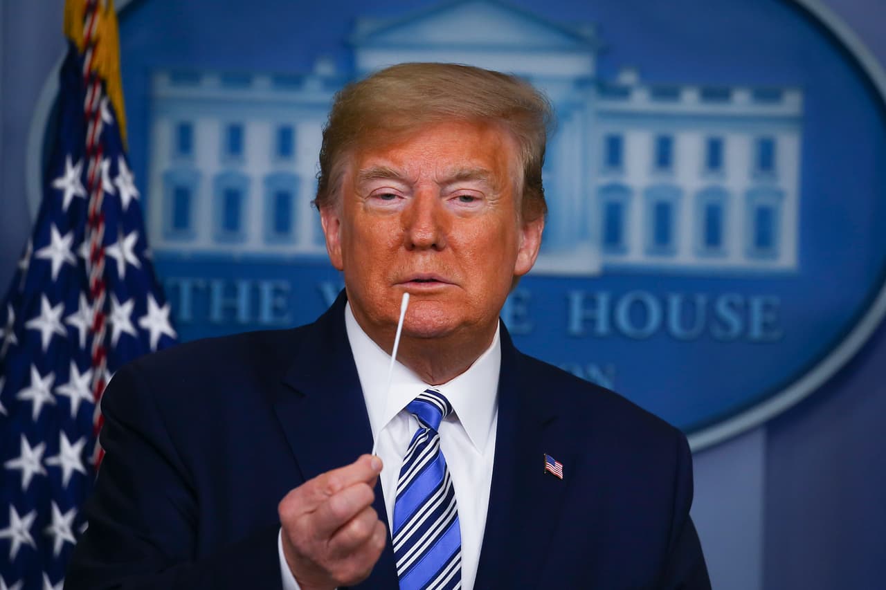 WASHINGTON, DC - APRIL 19: US President Donald Trump holds up swabs as he speaks at the daily coronavirus briefing at the White House on April 19, 2020 in Washington, DC. New York state will begin the nation's most aggressive COVID-19 antibody testing campaign this week even as some states begin to loosen restrictions amid pressure to restart the economy. (Photo by Tasos Katopodis/Getty Images)