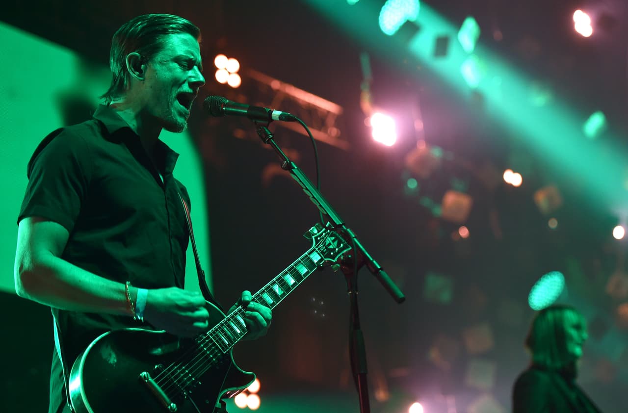 Paul Banks, of Interpol, performs at the 25th annual KROQ Almost Acoustic Christmas at The Forum on Sunday, Dec. 14, 2014, in Inglewood, Calif. (Photo by John Shearer/Invision/AP)