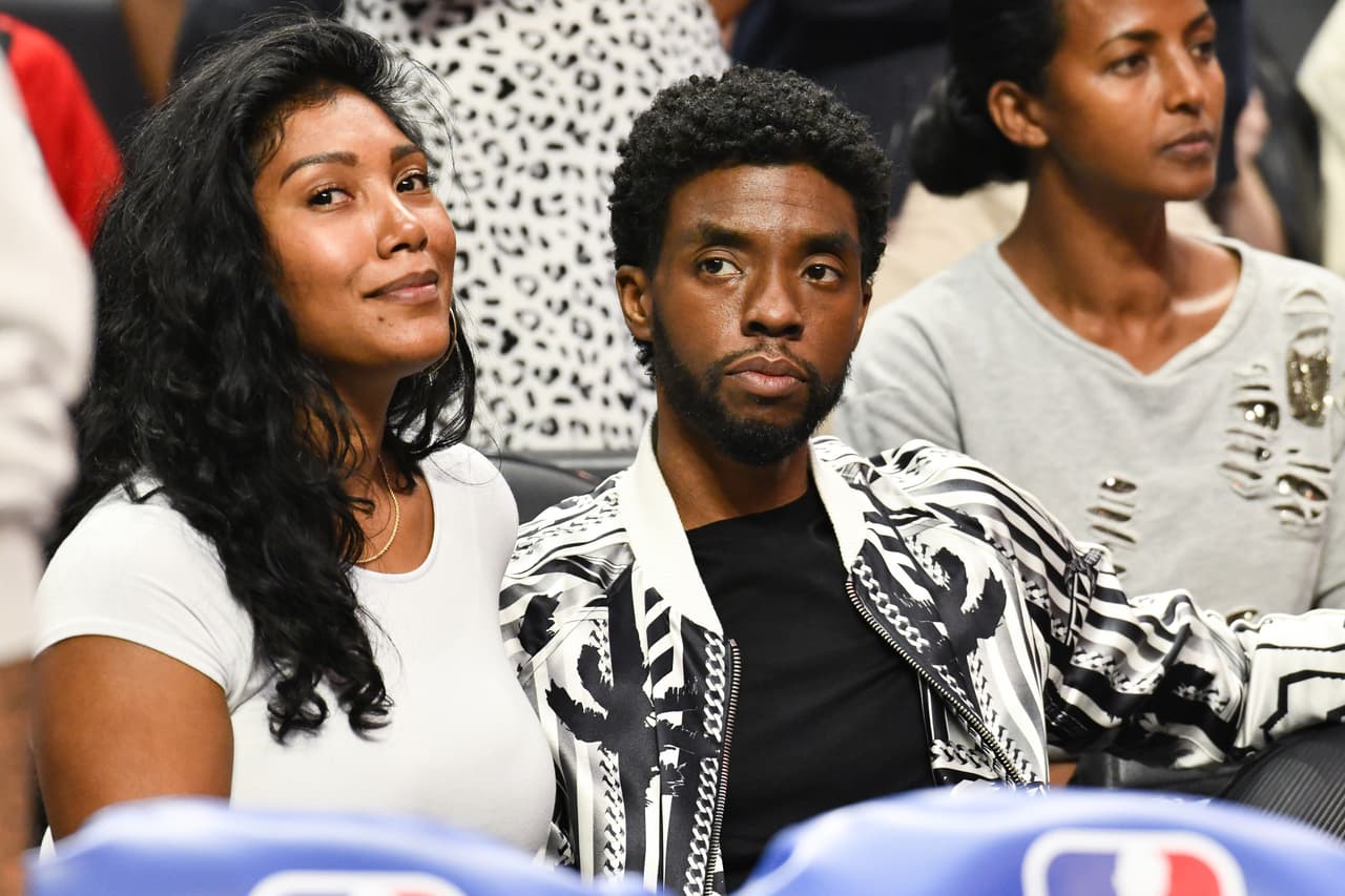 LOS ANGELES, CALIFORNIA - OCTOBER 22: Taylor Simone Ledward and Chadwick Boseman attend a basketball game between the Los Angeles Clippers and the Los Angeles Lakers at Staples Center on October 22, 2019 in Los Angeles, California. (Photo by Allen Berezovsky/Getty Images)