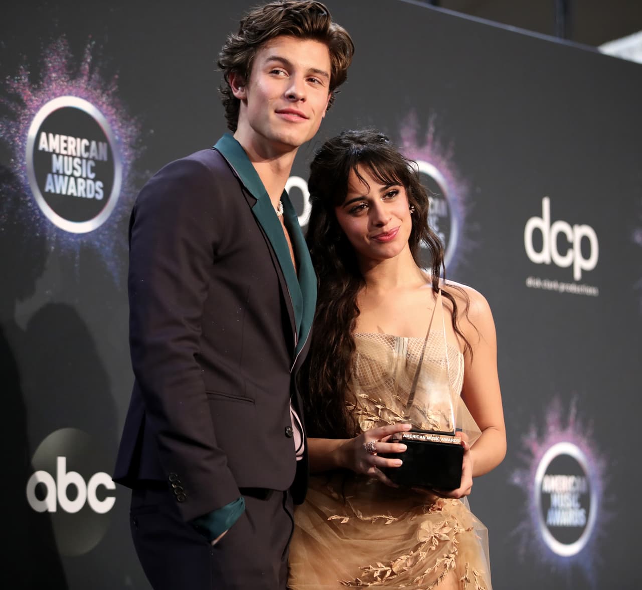 LOS ANGELES, CALIFORNIA - NOVEMBER 24: (L-R) Shawn Mendes and Camila Cabello, winners of the Collaboration of the Year award for 'Señorita,' pose in the press room during the 2019 American Music Awards at Microsoft Theater on November 24, 2019 in Los Angeles, California. (Photo by Rich Fury/Getty Images)