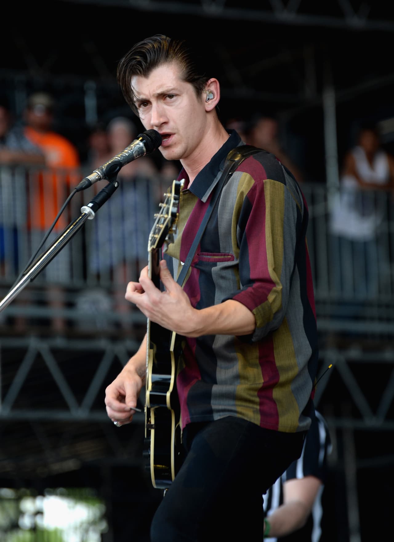 MANCHESTER, TN - JUNE 15: Alex Turner of Arctic Monkeys performs onstage at What Stage during day 4 of the 2014 Bonnaroo Arts And Music Festival on June 15, 2014 in Manchester, Tennessee. (Photo by Jeff Kravitz/FilmMagic for Bonnaroo Arts and Music Festival)