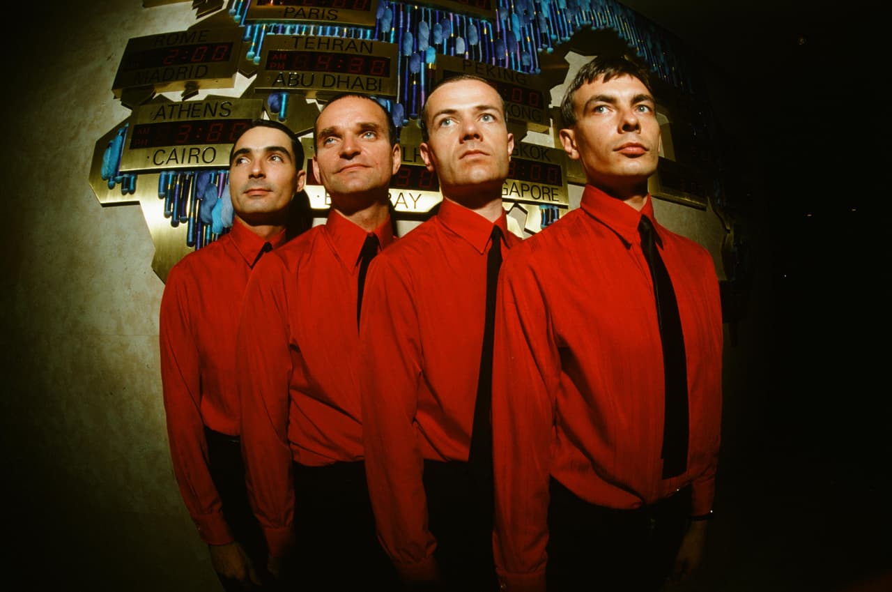 (MANDATORY CREDIT Koh Hasebe/Shinko Music/Getty Images) Kraftwerk in front of world time clock in Keio Plaza Hotel, Tokyo, September 1981. (Photo by Koh Hasebe/Shinko Music/Getty Images)